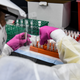 A Lab Technician Sorting Blood Samples for COVID-19 Vaccine Testing
